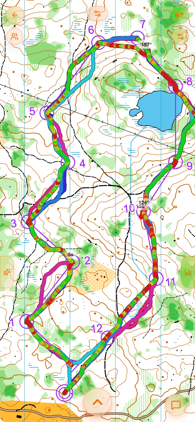 The run screen: the map with a pace-coloured track and chips at its edges